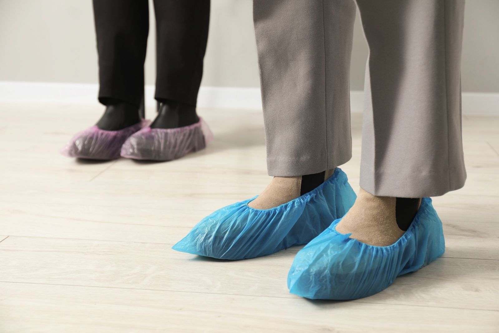 Women wearing blue shoe covers